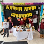 a group of people standing in front of a store